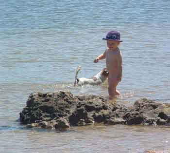 Australian toddler wearing hat for protection from hole in ozone layer